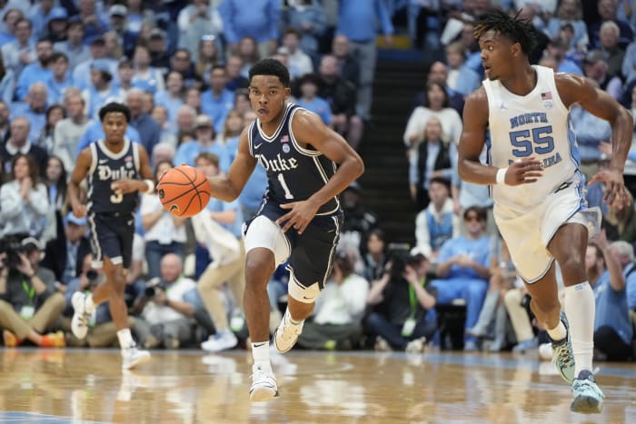 Duke Blue Devils guard Caleb Foster dribbles up court.